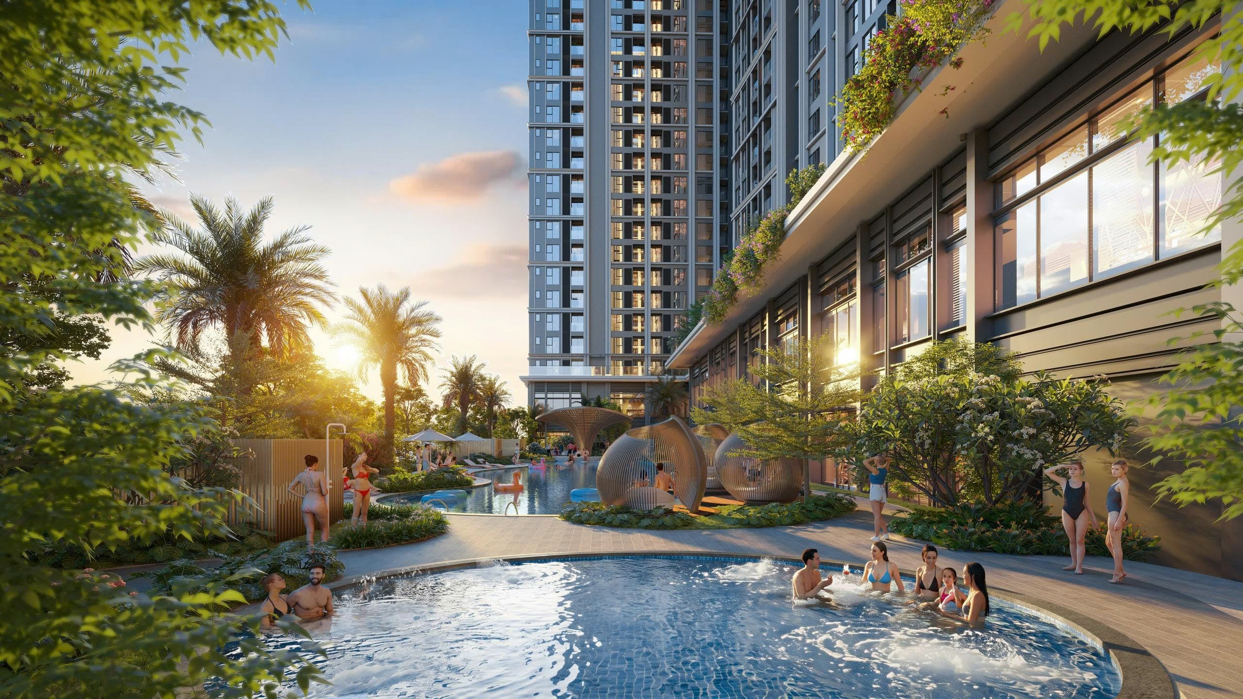 Bể sục tròn sủi bọt, cabana hình kén và hồ bơi nội khu rợp cây xanh dưới tòa tháp