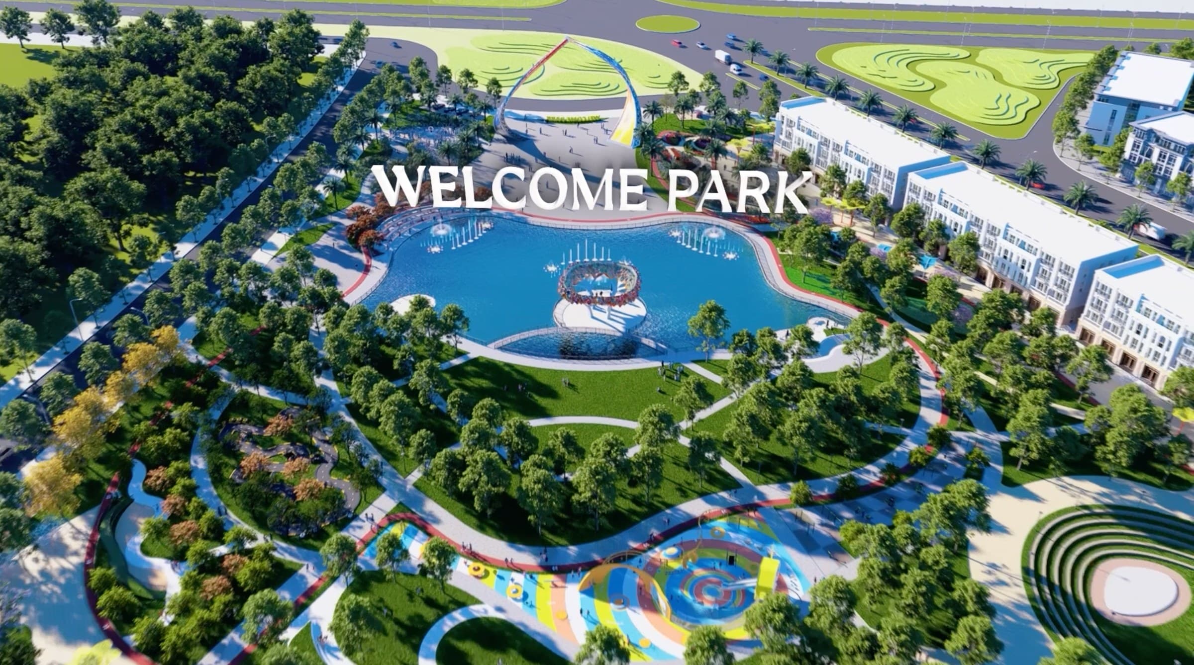 Phối cảnh từ trên cao quảng trường chào đón Welcome Park với hồ nước trung tâm, đường dạo uốn quanh và dãy nhà thấp tầng bao ngoài